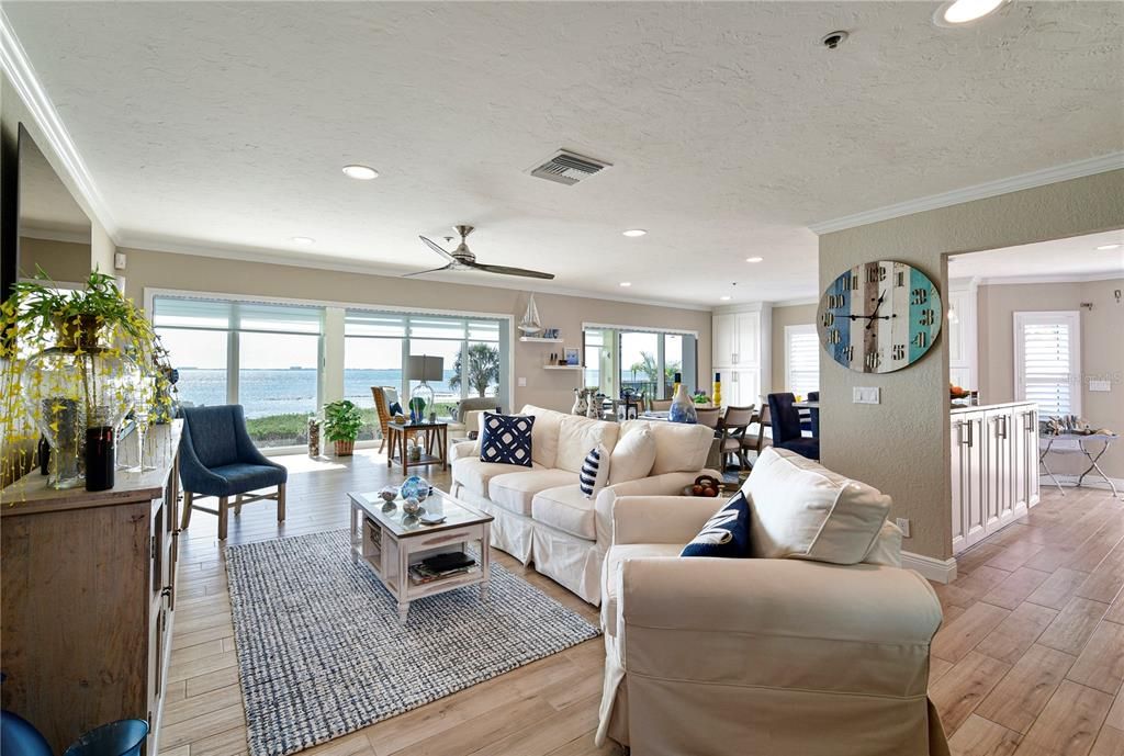 Virtually staged and renovated, open living/dining room with bay views