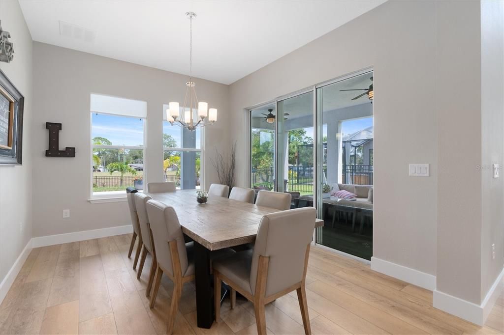 Beautiful Dining Area Open To Kitchen and Great Room w/Sliders to Lanai