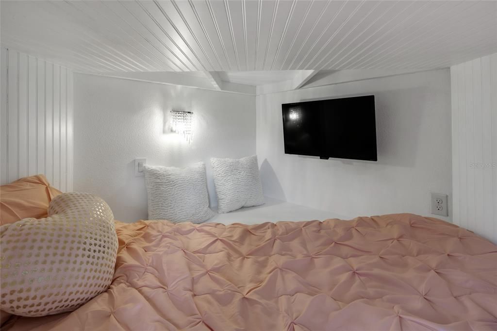 Interior of princess bunk bed with private TV