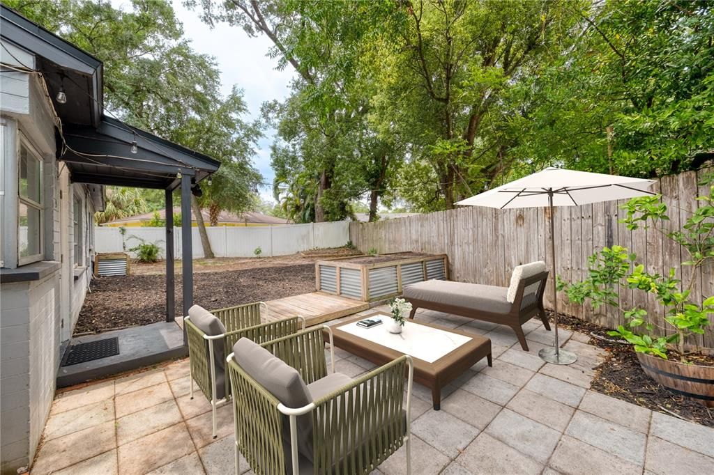 VIRTUALLY STAGED Fully fenced backyard with plenty of space for kids and pets