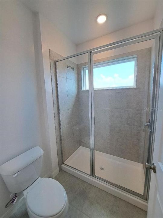 Master Bathroom - Commode and step in shower for Master bath.