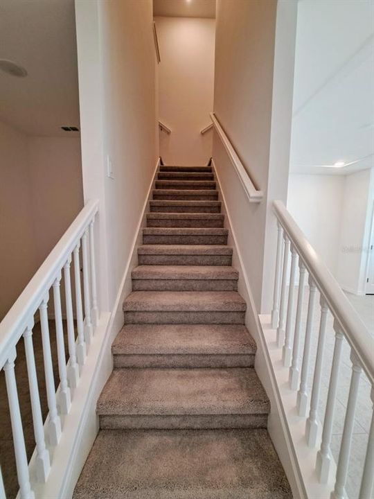 Other - Stairway leading to three bedrooms and two full baths plus Laundry room.