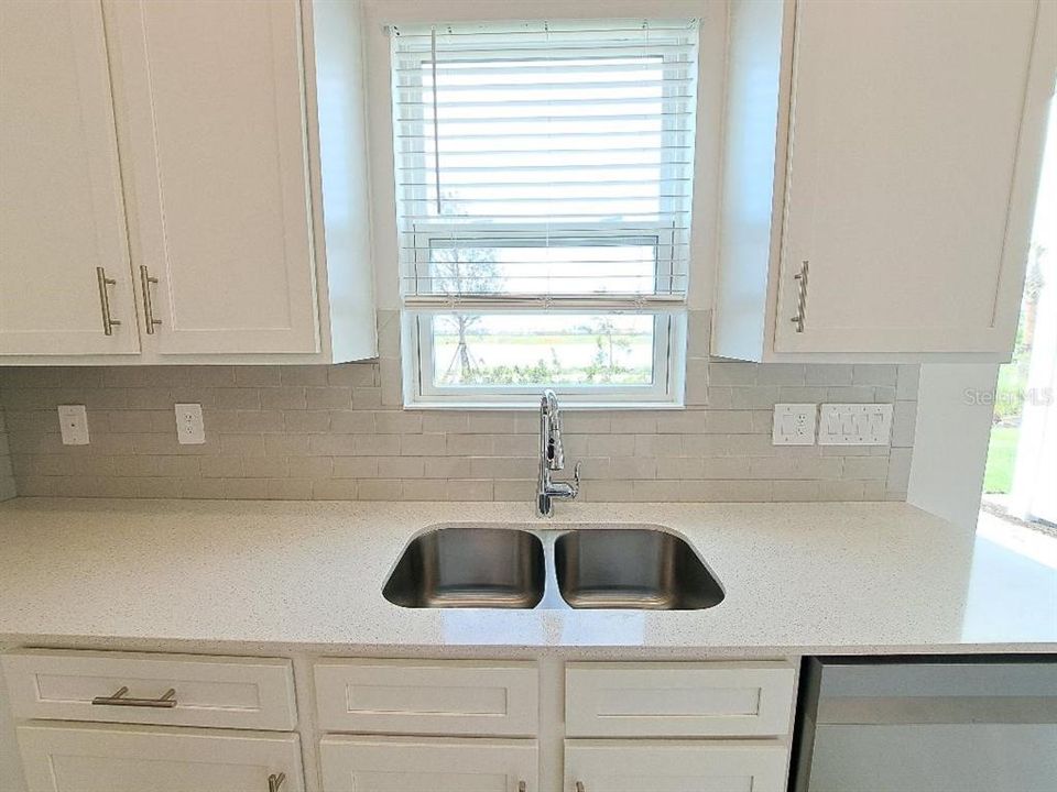 View - More lake views from the Kitchen window. Enjoy doing dishes while watching nature from your own home.