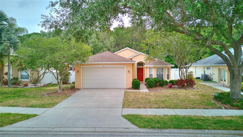 The trees, sidewalks and matching mailboxes add to this home and the neigborhood's charm.