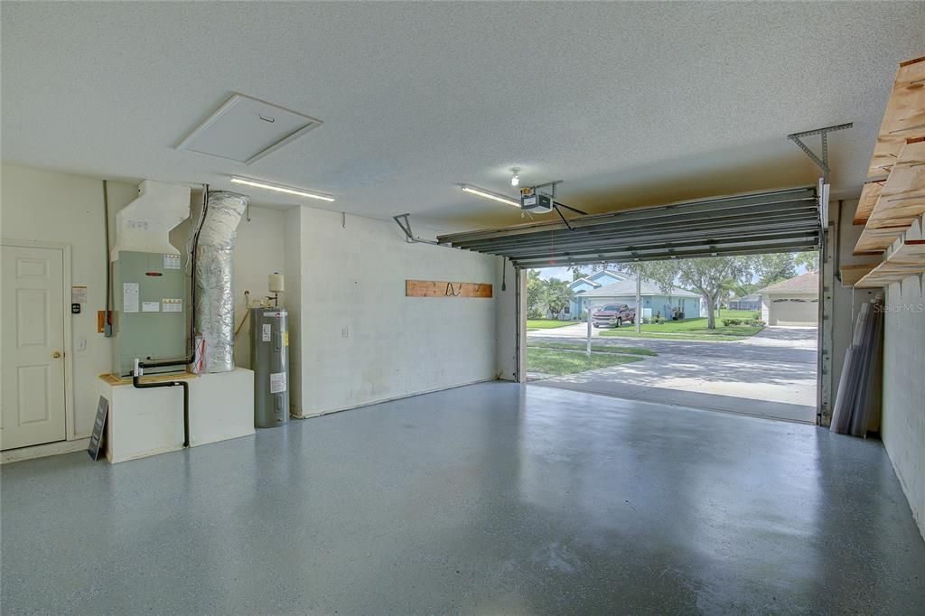 The recently updated kitchen, includes pantry, wood cabinets, quartz counters, and stainless steel appliances. The dishwasher matches the wood cabinets. Deep drawers make getting to pots and pans easier.