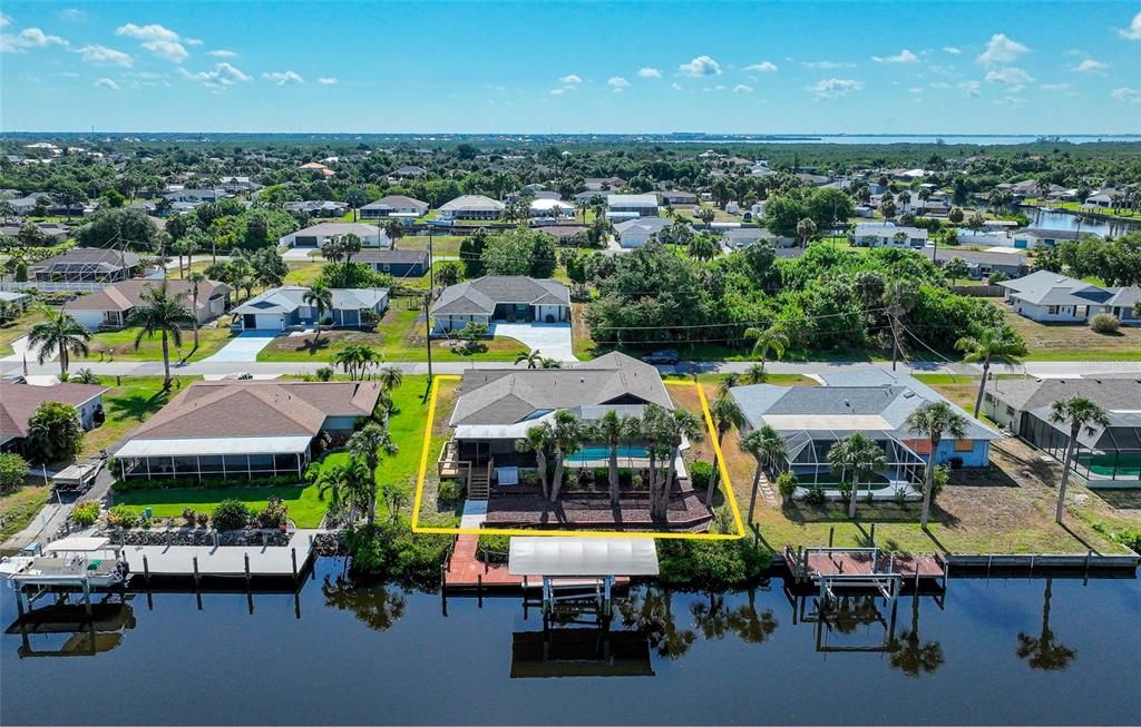 Waterfront with dock, covered boat slip