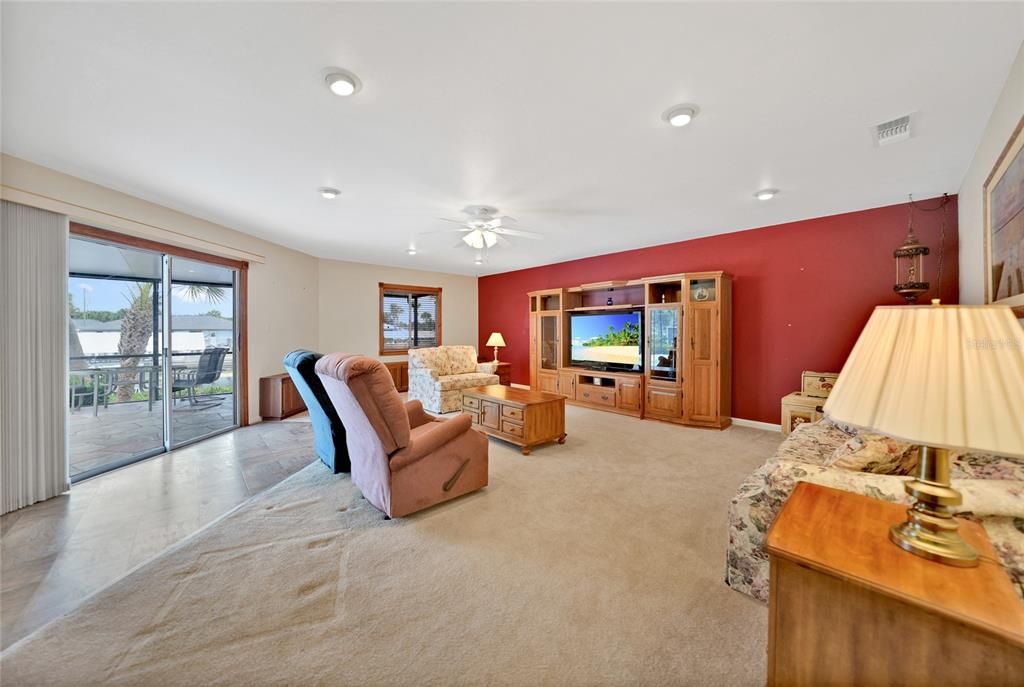 Family room with sliding door to enclosed pool area!