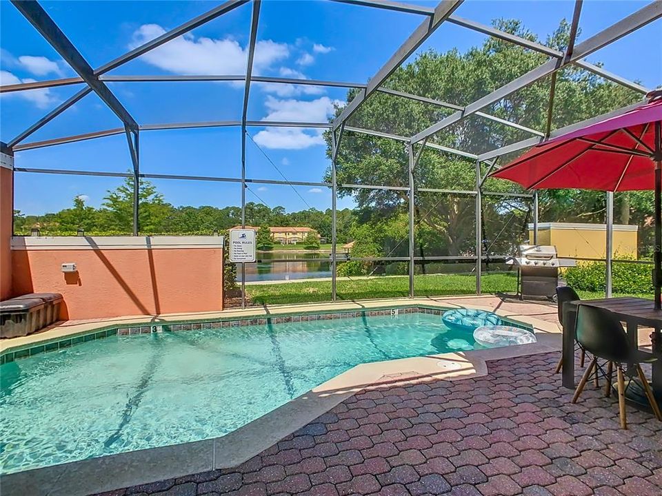 Relax and unwind in your own private oasis, overlooking the serene lake. Enjoy poolside dining under the shade of your red umbrella, perfect for those sunny Florida afternoons. Welcome to your new vacation home at 3179 Yellow Lantana Ln!