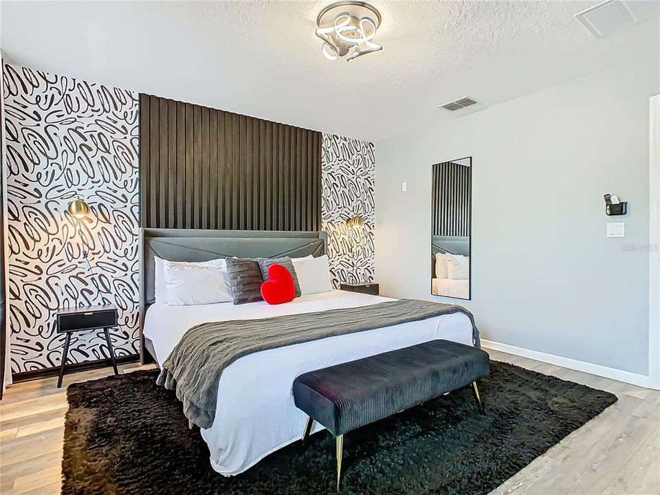 Fall in love with this stylish master bedroom at 3179 Yellow Lantana Ln! With chic decor, a cozy oversized bed, and a touch of Disney magic, this townhouse in the heart of Kissimmee ensures sweet dreams every night. Perfect for vacations or year-round living!