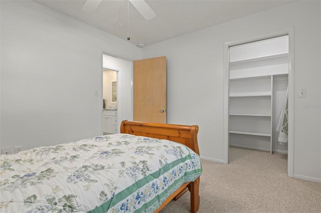 Primary bedroom to primary bathroom. Large walk-in closet.