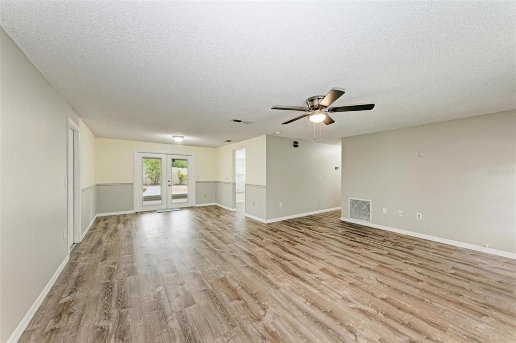 Living Room/Dining Room to back yard and screened porch