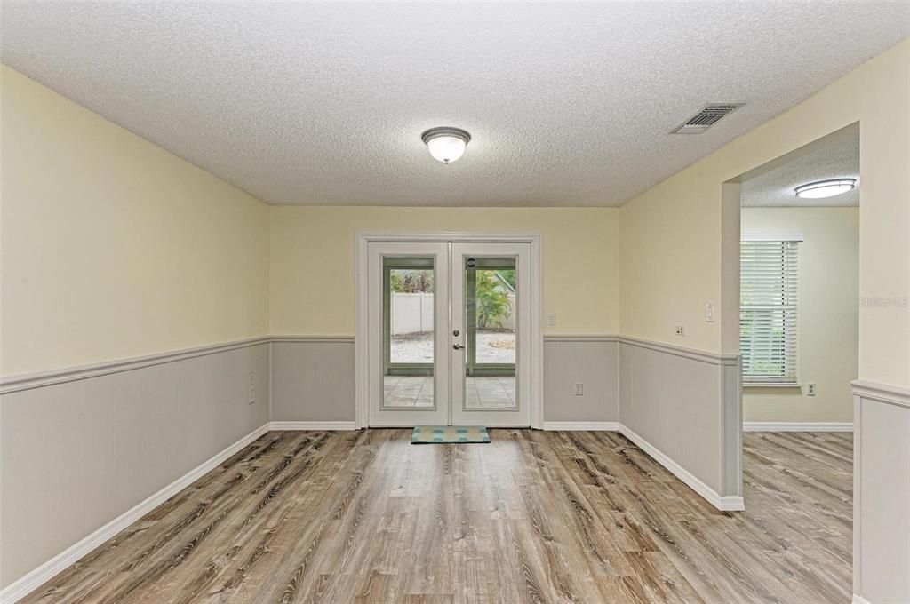 French Doors to Screened porch and back yard.  Kitchen to the right.