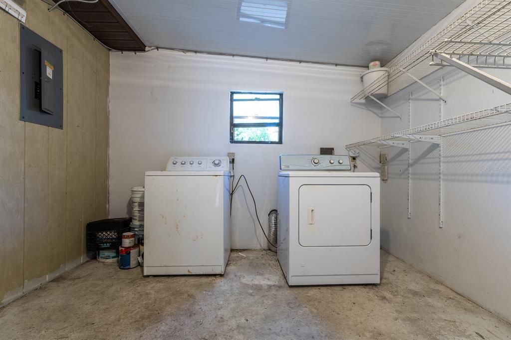 Large laundry room with storage