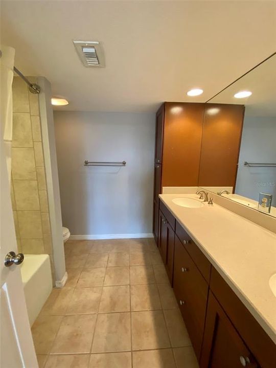 Master Bath Ensuite with dual sinks and linen closet