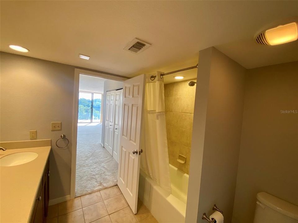 Master Bathroom with tub shower combo and dual sinks