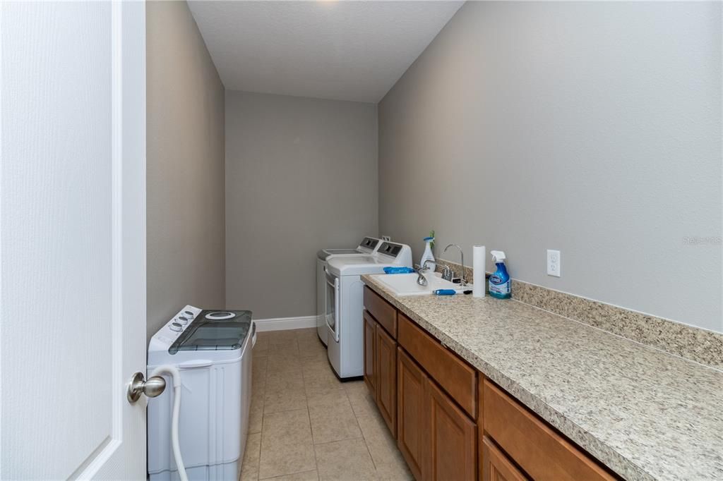 Huge laundry room with plenty of work space. Washer and dryer included!