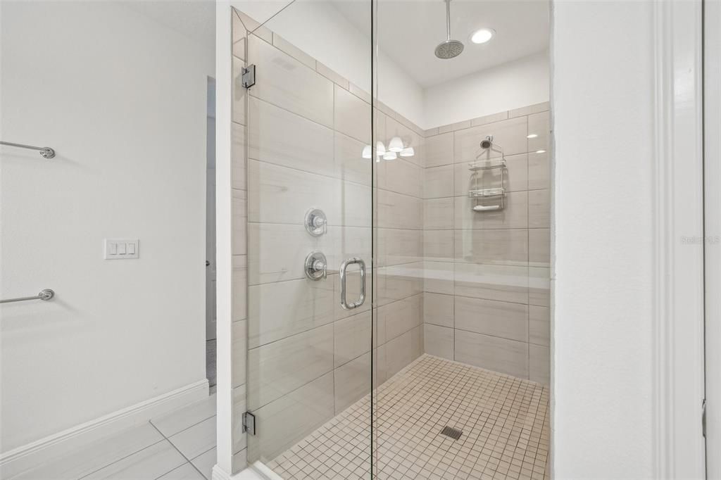 Oversized tile shower with Rain shower head & frameless glass door