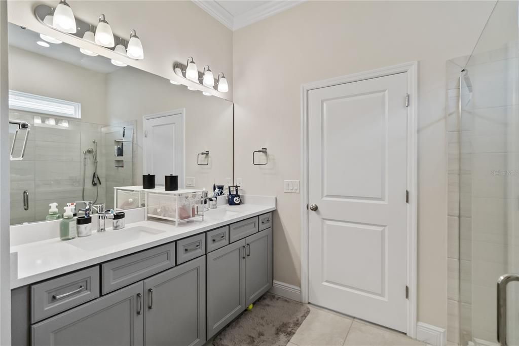 Double sink vanity in primary bathroom.