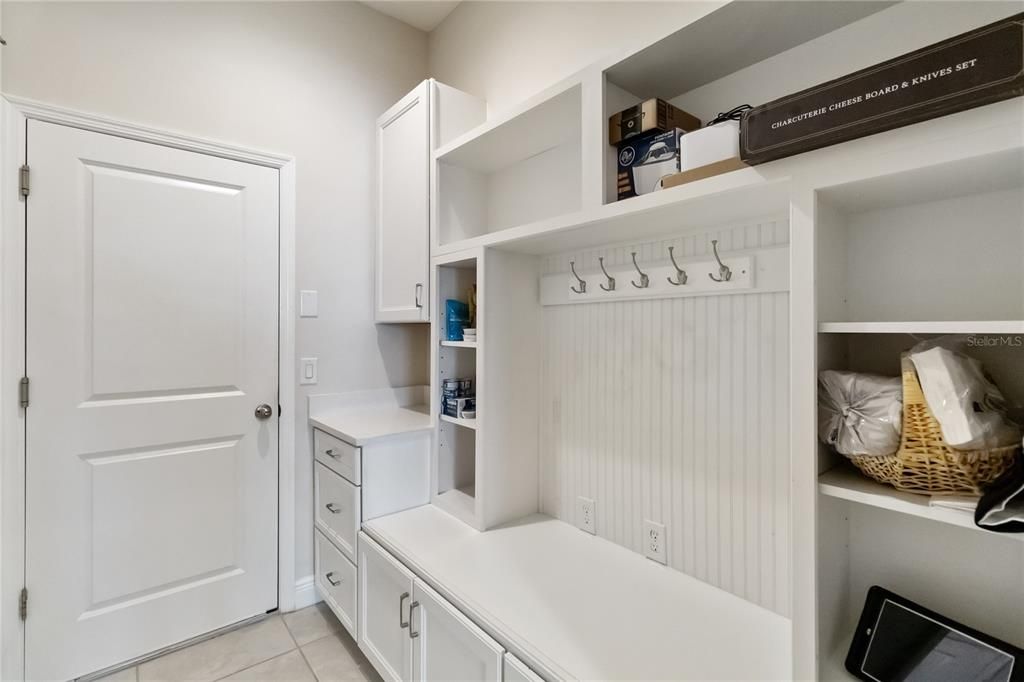 Mud room from garage with seating and storage!