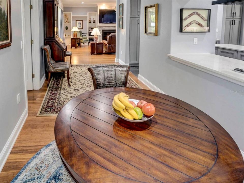 Breakfast room just off of the kitchen to the right and view of family room.