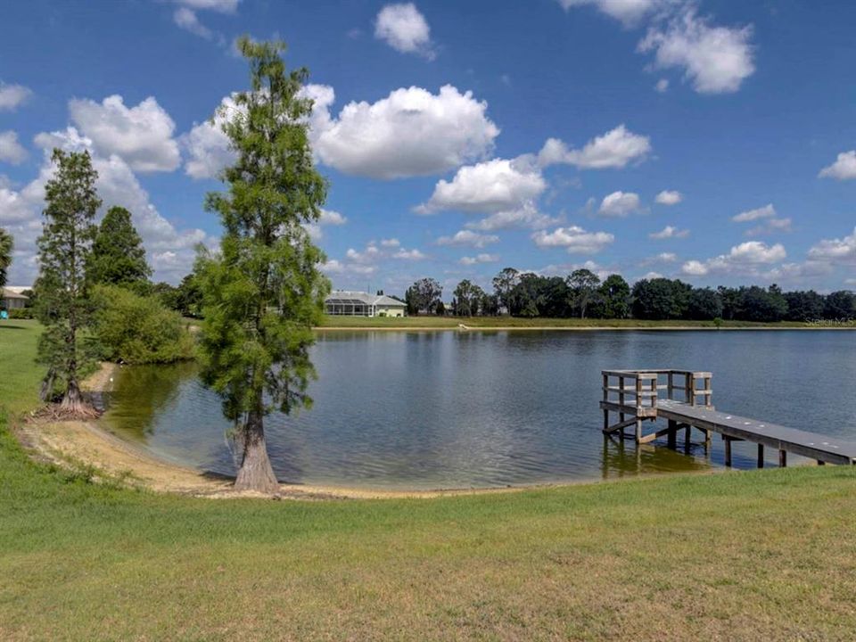 Square lake with dock.