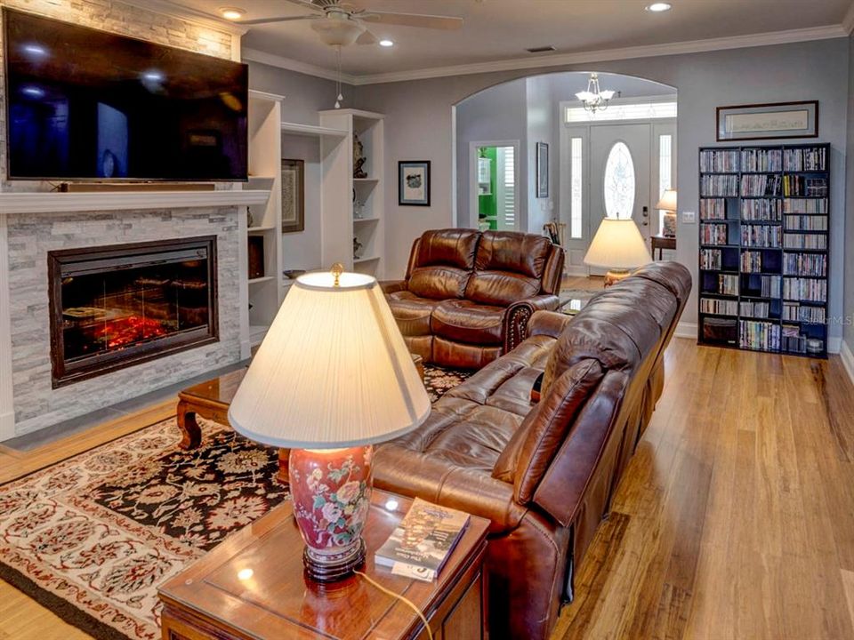 Family room with electric fireplace.