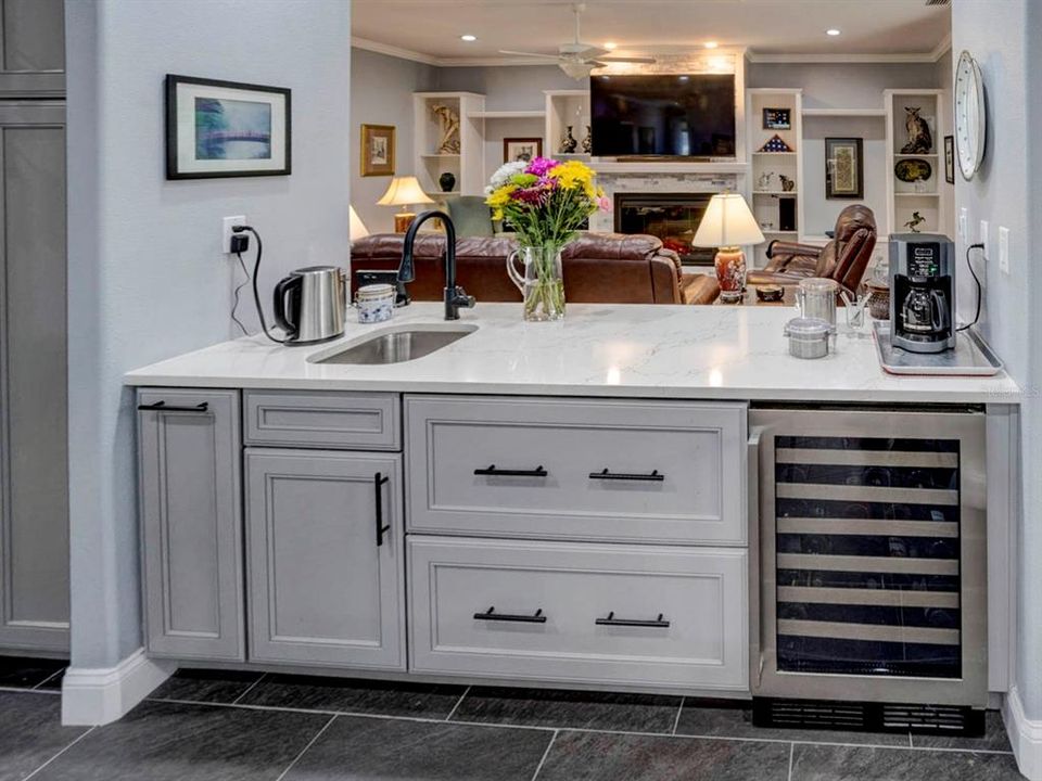 Wet bar/coffee bar with wine cooler.