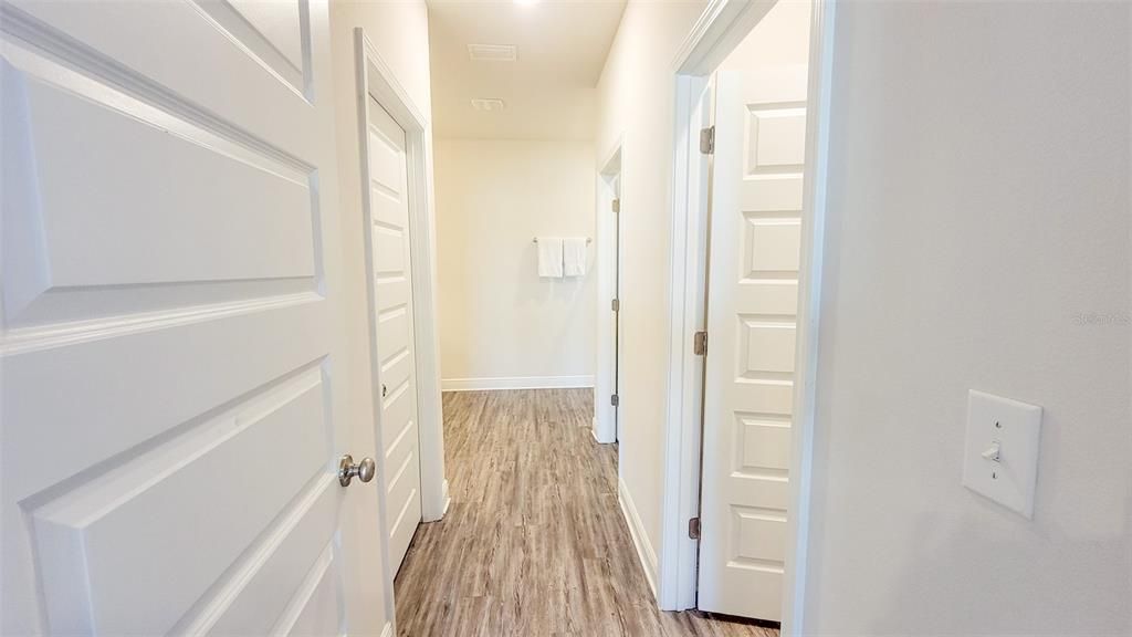 Hall to closets and primary bath