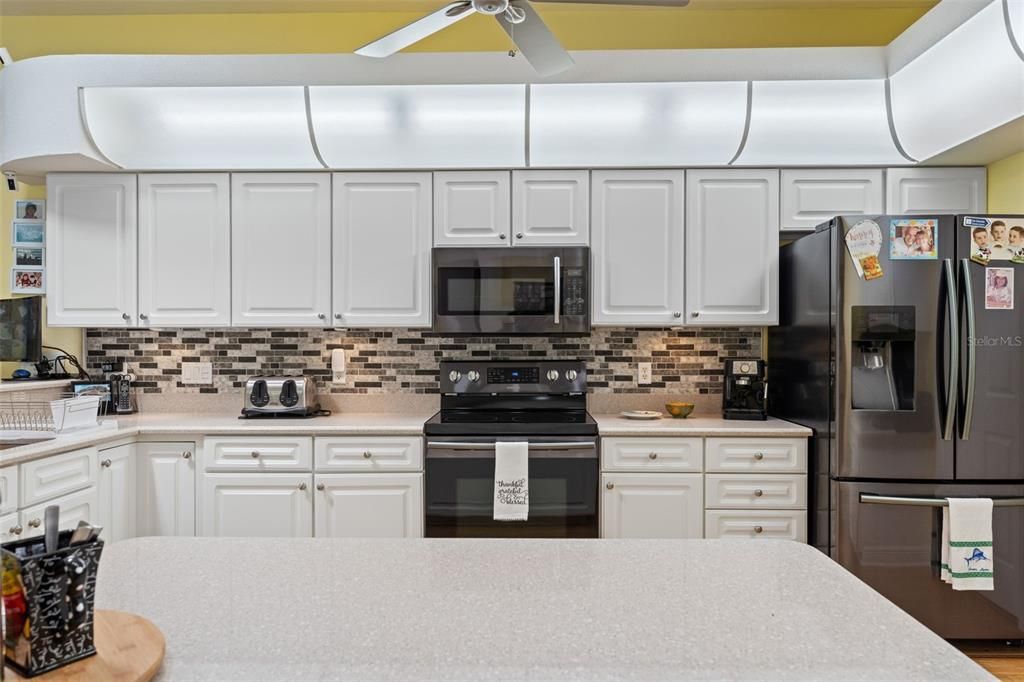 White Cabinets, Corian Counters & 3 Year Old Samsung Appliances