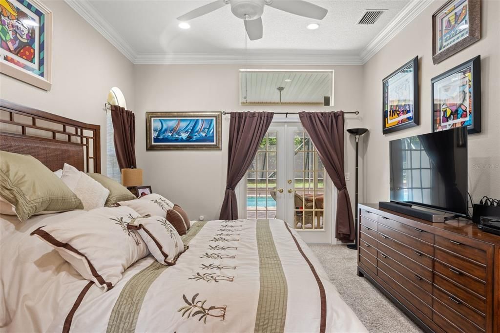 Crown Molding, Transom Windows & French Doors out to the Pool Area from the Master Bedroom