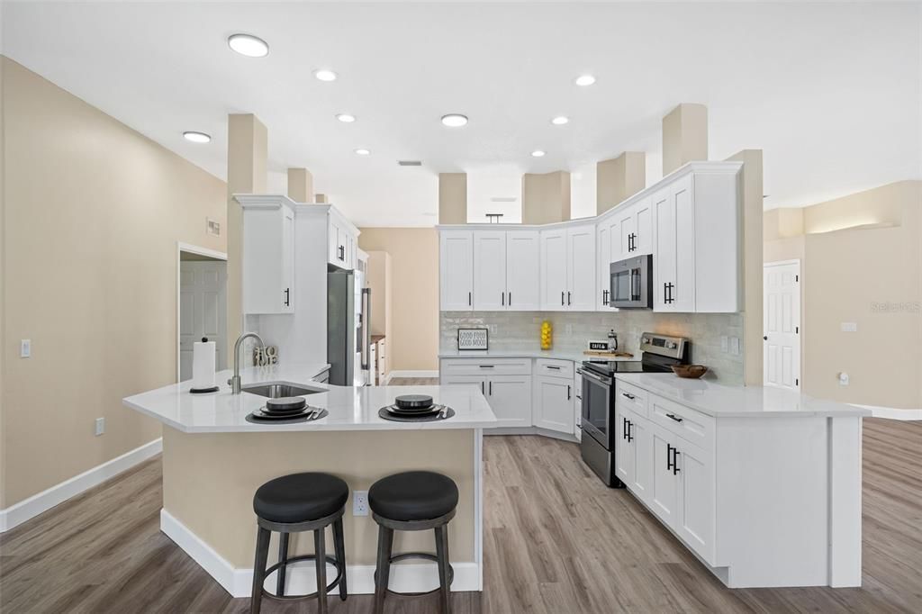 Open concept kitchen with separate breakfast nook