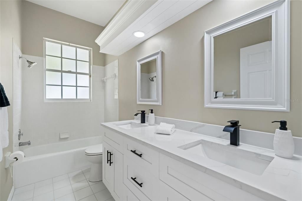 2nd full bathroom with dual vanities, quartz counters and dual sink