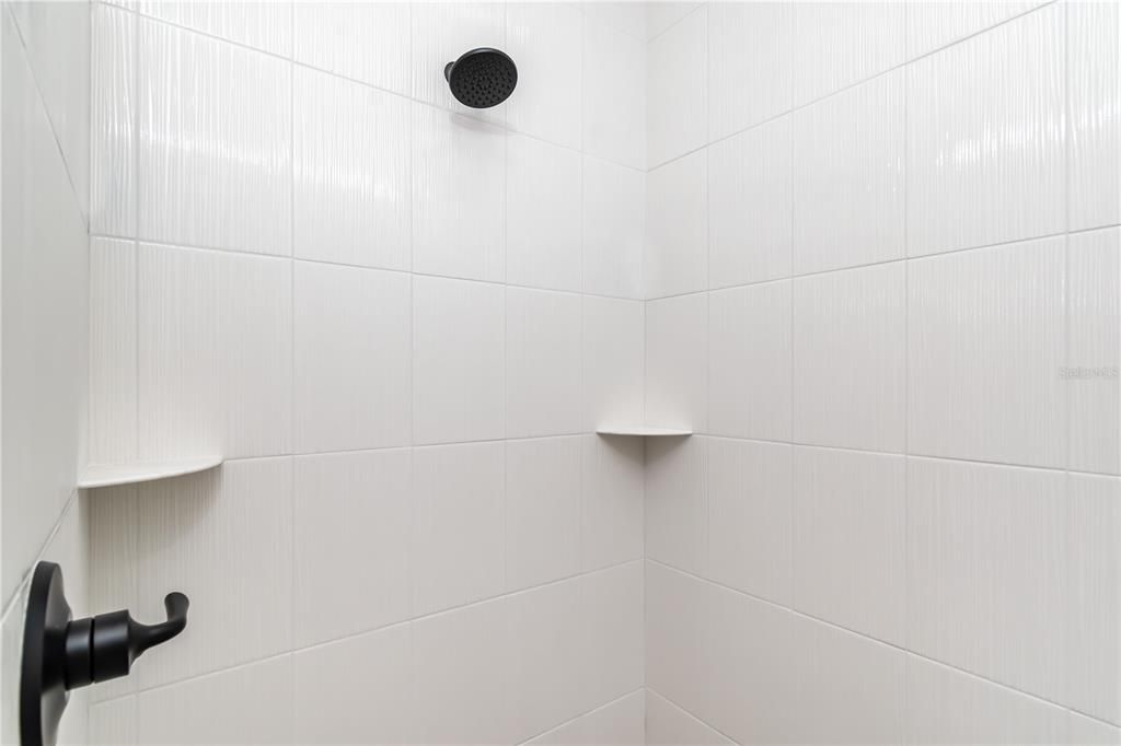 Primary Bathroom with Floor to Ceiling Tiled Shower