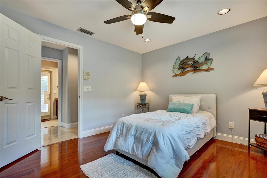 This room has a full  bath right across the hall. The bathroom also is the pool bath.