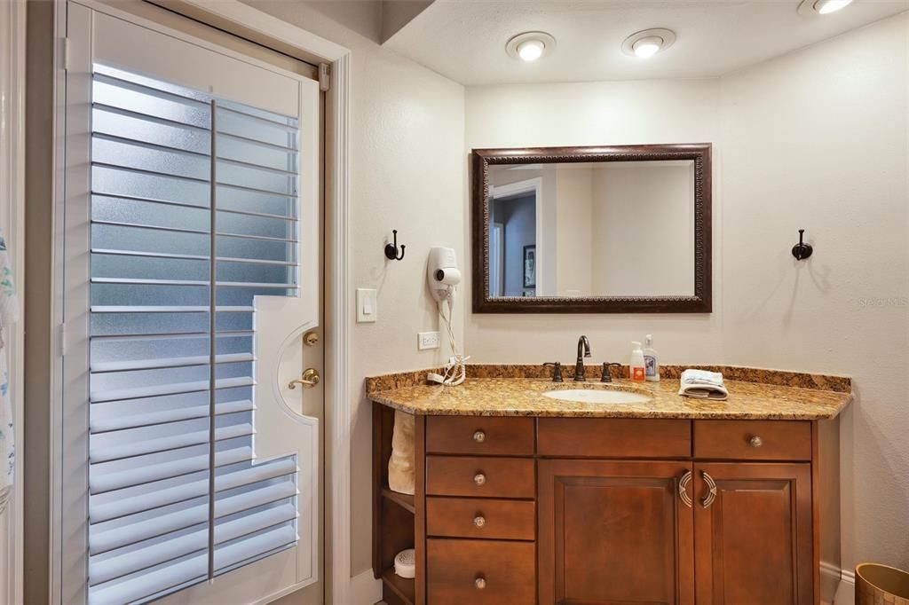 2nd full bathroom, with exit door to the pool. This bathroom is located in the hall between bedrooms 2 and 3.