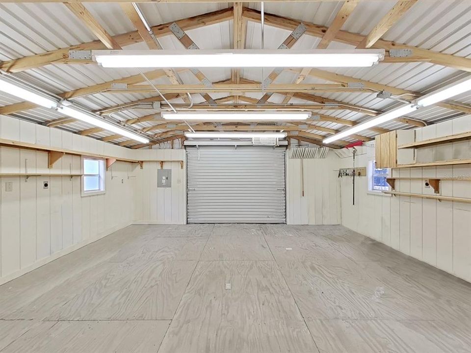 Inside of 19x19 Outbuilding Workshop/Garage with electrical! Clean and so versatile for use! Workshop, boat/lawn equipment/trailer storage...Great space!!