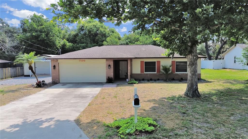 Great curb appeal with fresh paint and landscaping! Large driveway for extra parking!