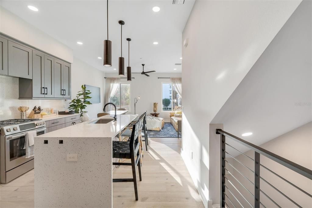 Impressive kitchen with a quartz waterfall island.