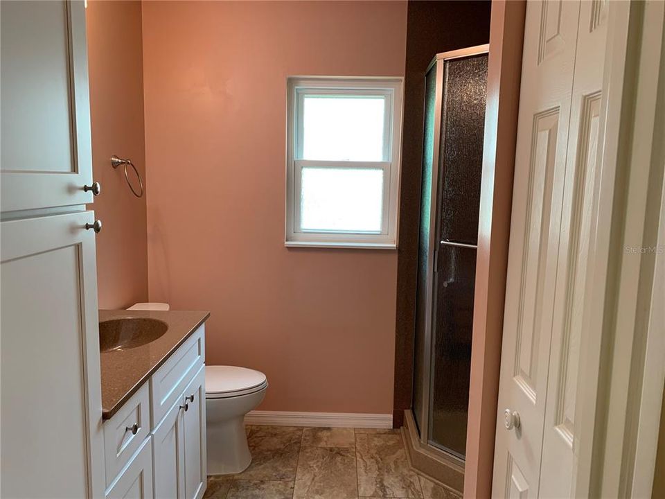 Master bathroom - updated cabinets, walk in corner shower, counter top and lighting