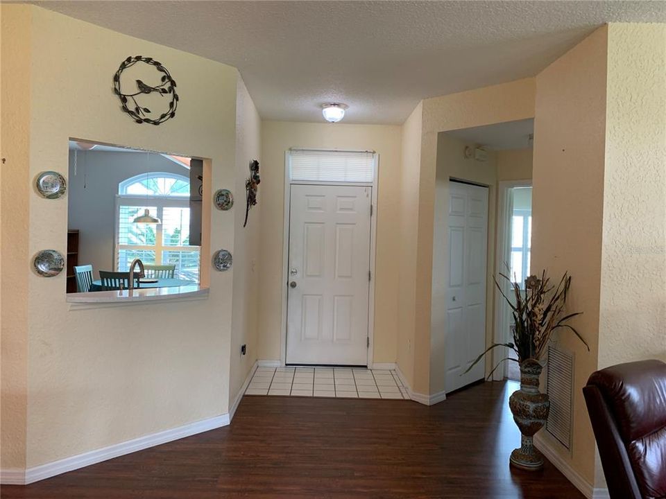 Front entry way - pass through window - guest bedroom and bath to right