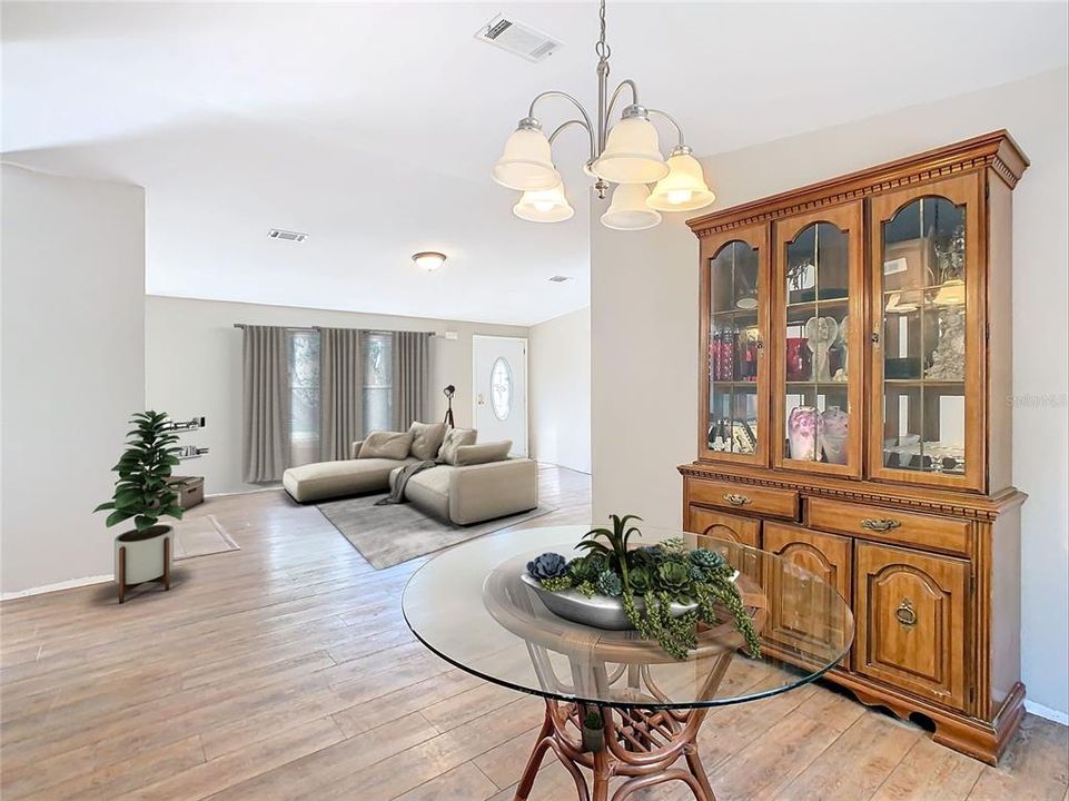 Partial staged dining room open to 1 of 2 living areas