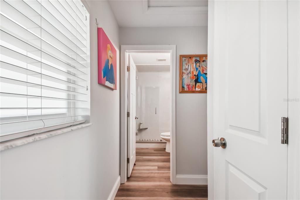 Hallway to guest bedroom, and  guest bathroom.