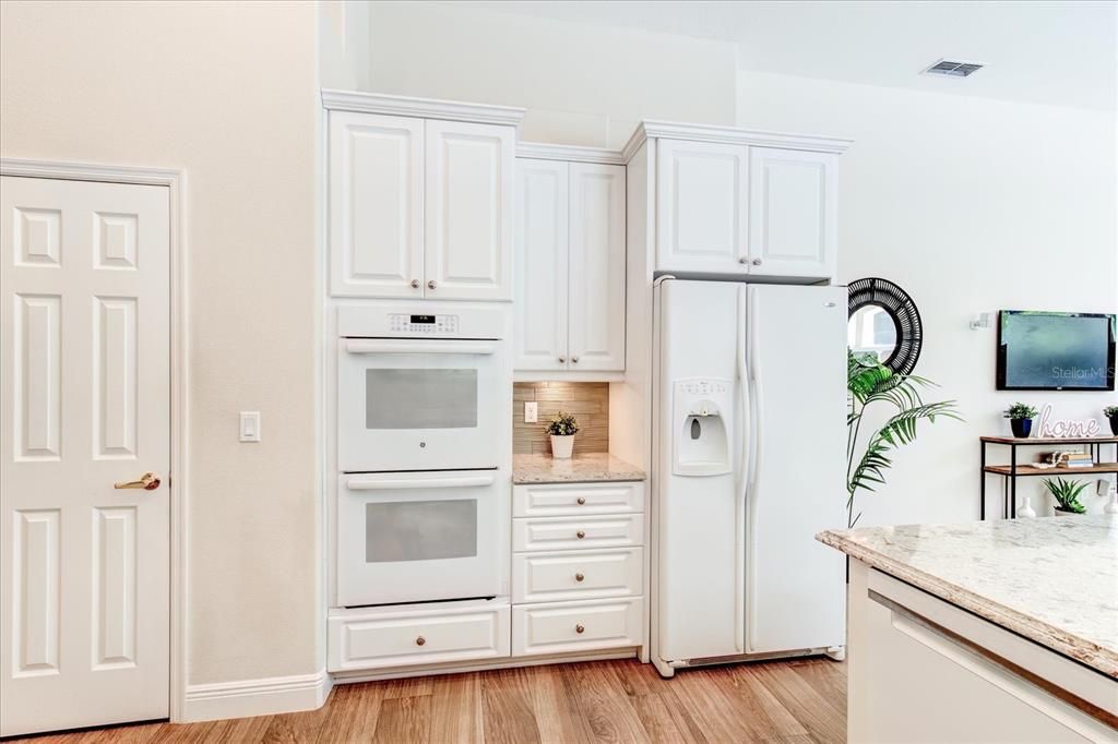 Kitchen with walk-in pantry and double oven.