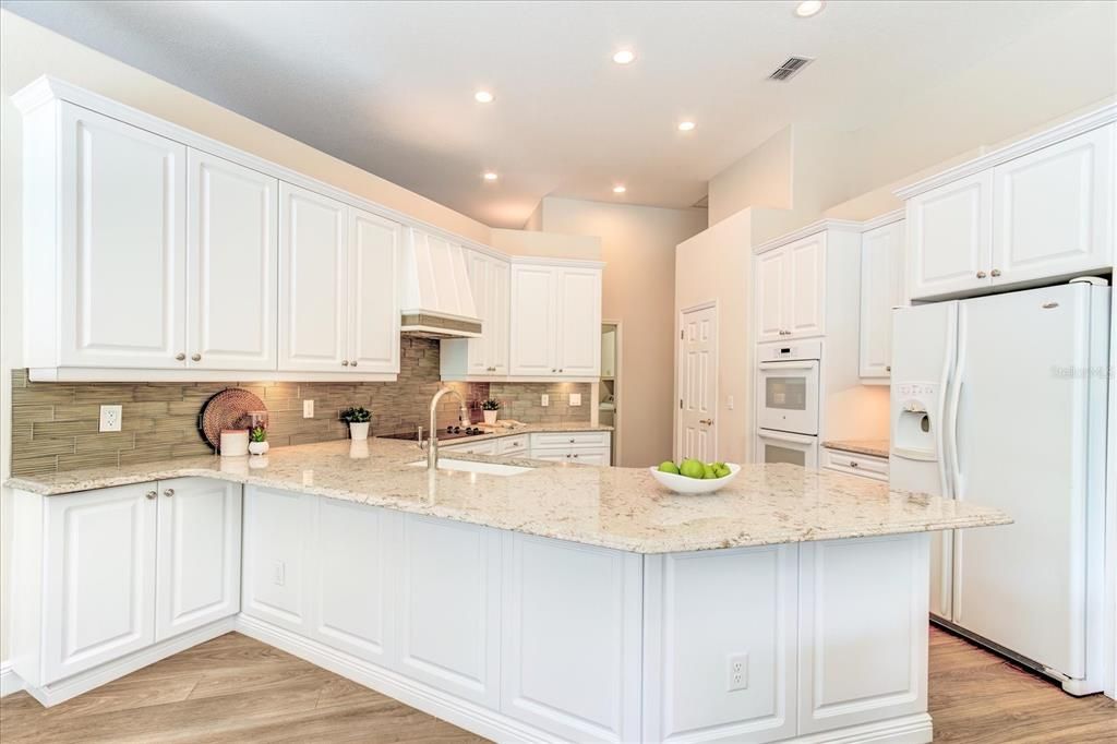 Beautiful kitchen with custom cabinets and granite countertops.