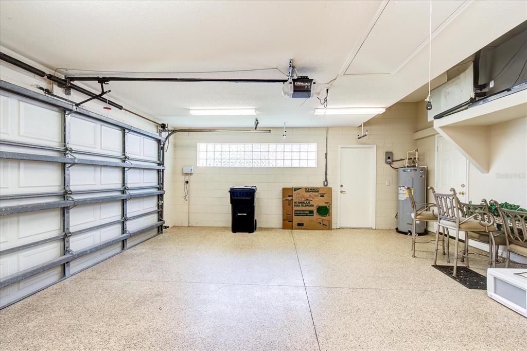 Large 2 car garage with epoxy flooring.