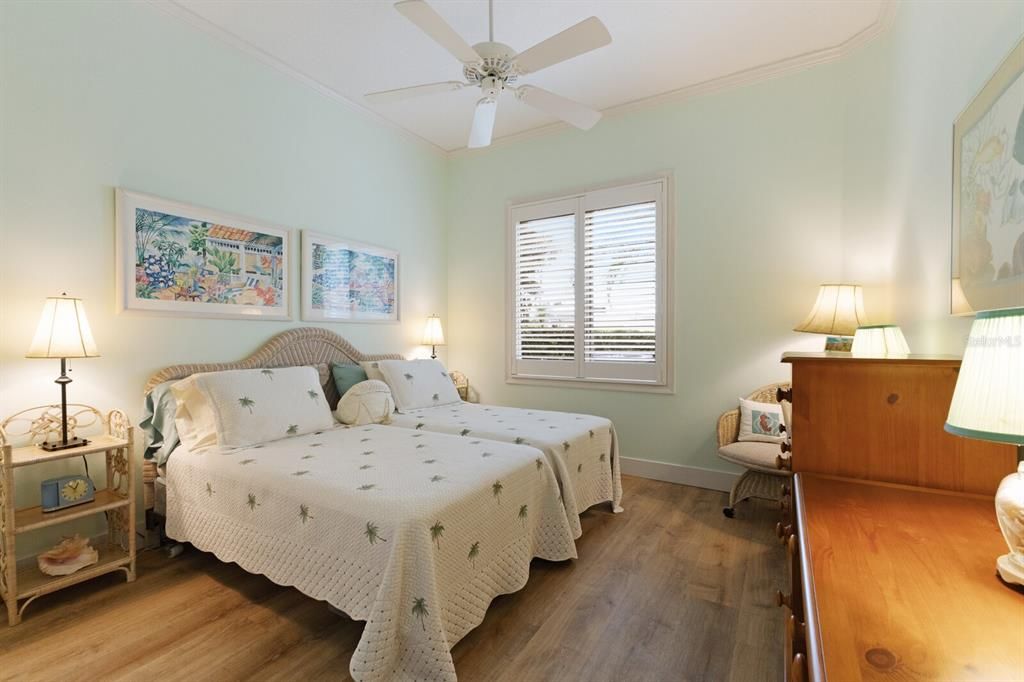 Guest bedroom located at the front of the home offering a split floorplan for guest privacy