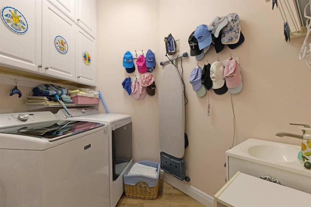 Laundry room with utility sink and extra storage