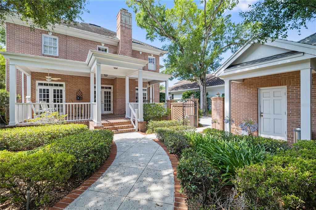 Landscaped back yard with spacious covered porch