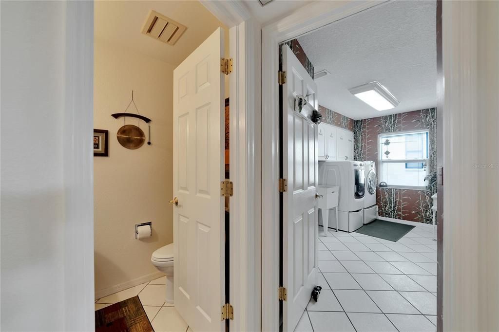 Hall with 1/2 bath and laundry