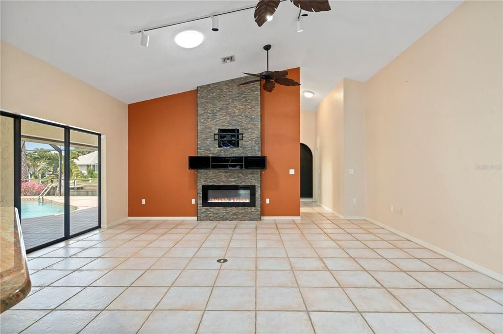 Vaulted ceilings, tile flooring and electric fireplace